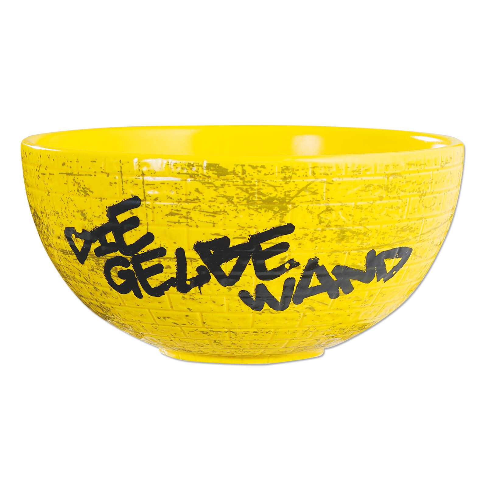 Seitenansicht der BVB-Müslischale Gelbe Wand in glänzendem Gelb mit schwarzer Aufschrift „Die Gelbe Wand“ im Graffiti-Stil und Struktur im Mauer-Look.