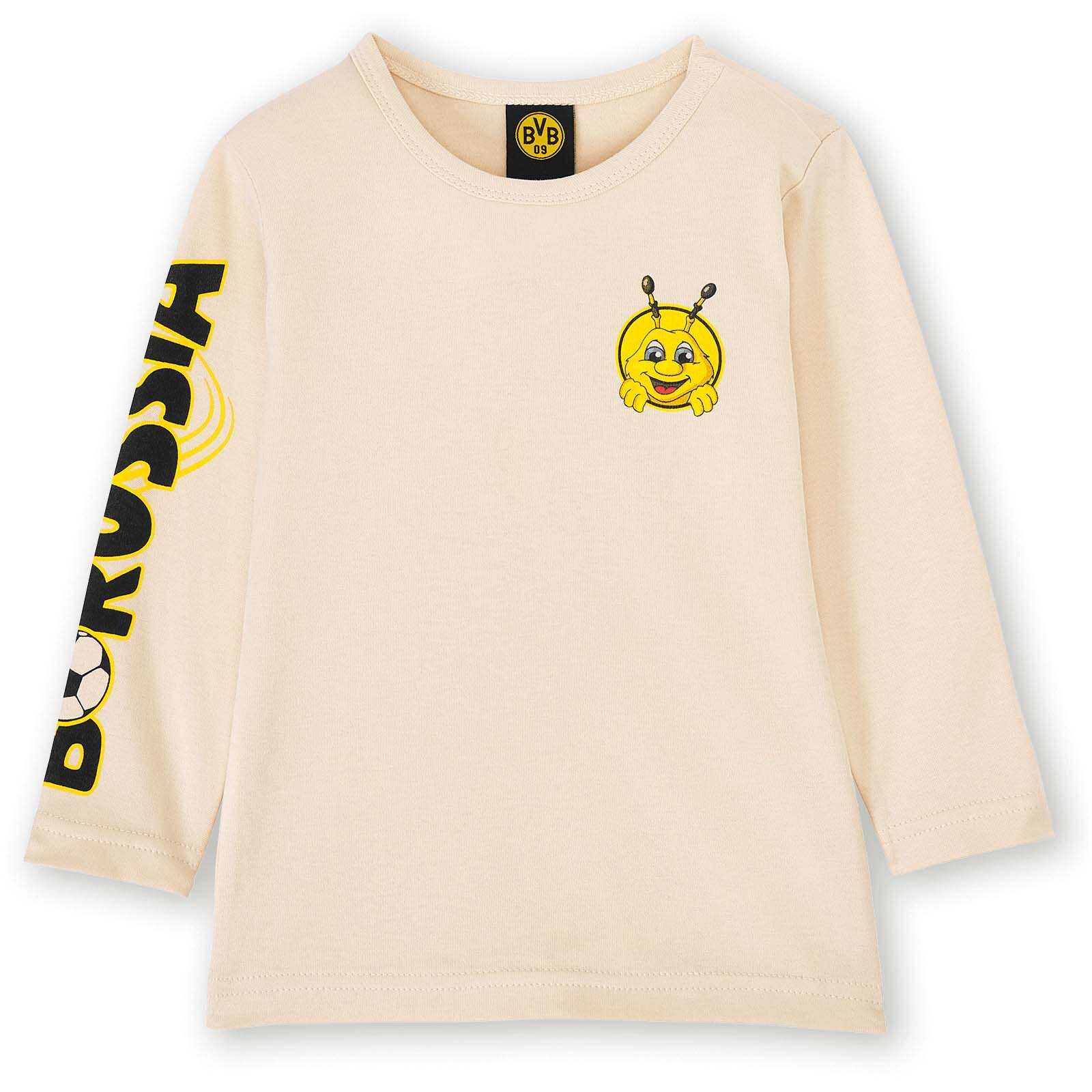 Vorderansicht des BVB Baby Langarmshirt EMMA in Beige mit EMMA-Motiv auf der Brust, BVB 09-Label im Kragen und Borussia-Schriftzug am Ärmel.