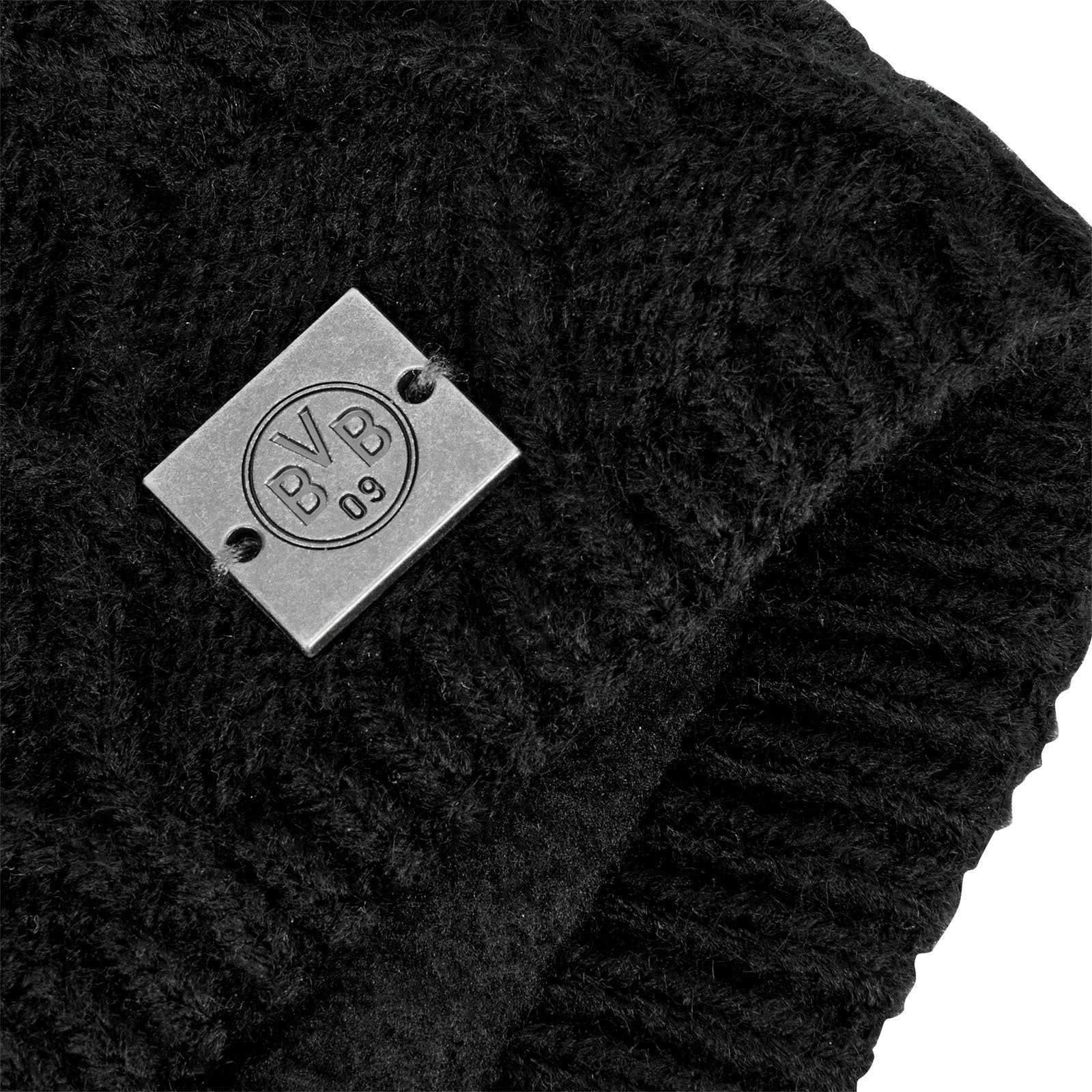 Detailansicht des schwarzen BVB Stirnband Damen mit gewebter Struktur und Metallplakette, auf der das BVB-Emblem zu sehen ist.