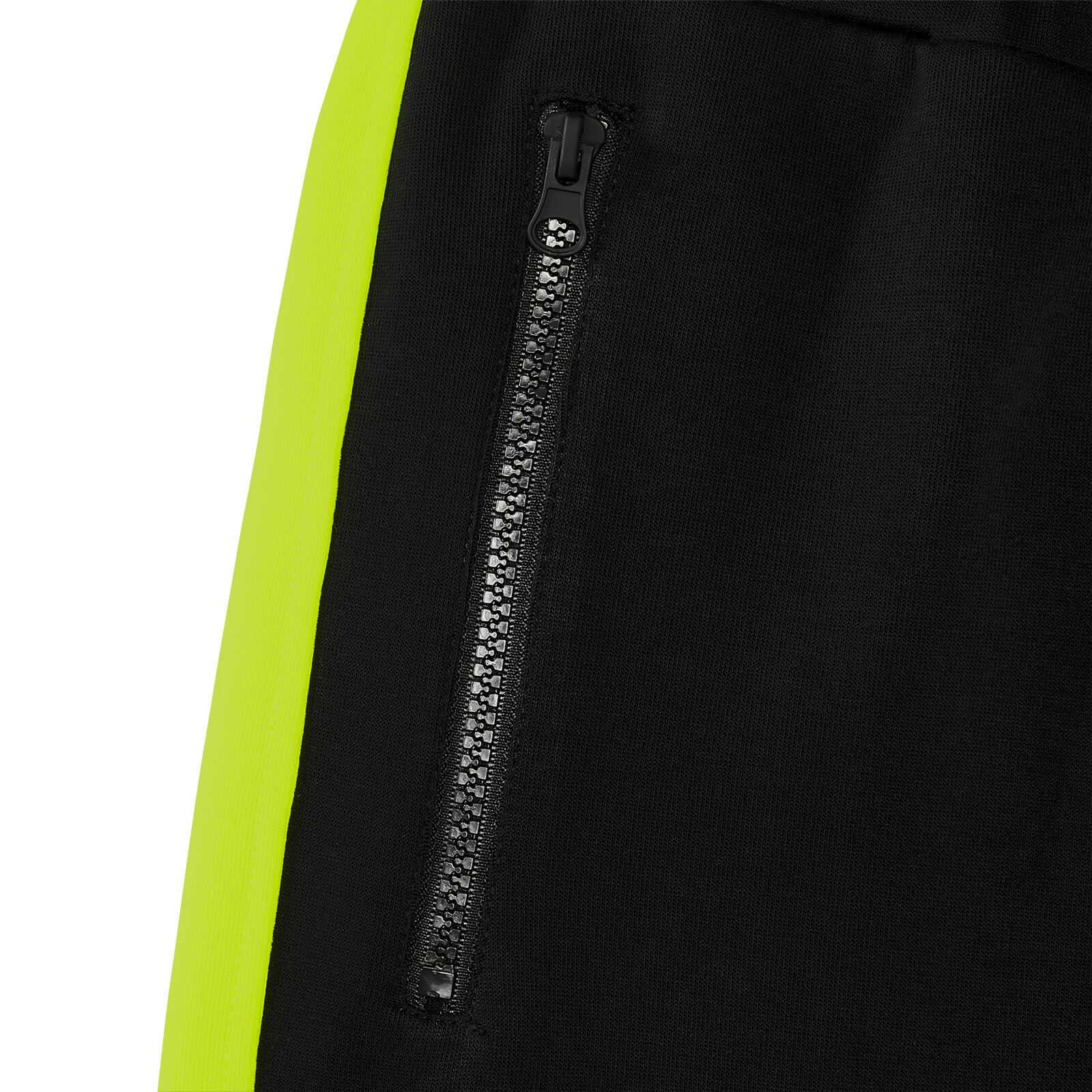Detailansicht der BVB Neon Sweatpants Damen in schwarzgelb mit seitlichem Reißverschluss und neonfarbenem Streifen am Bein.
