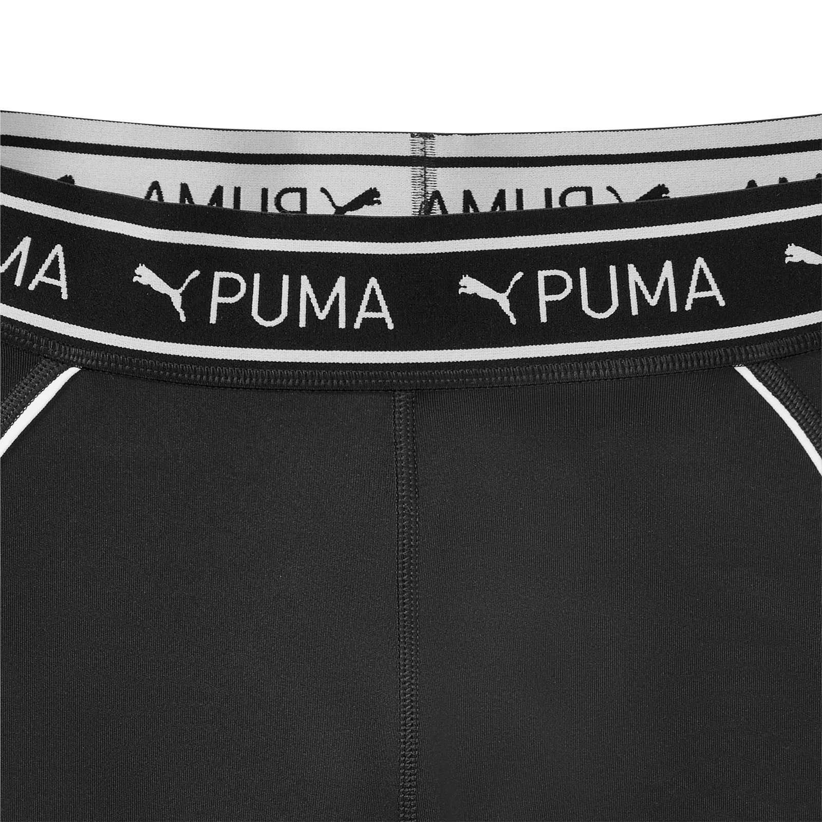 Detailansicht der BVB x Puma Gym Tain Strong 7/8 Tight für Frauen in schwarz mit sichtbarem, elastischem Bund und weißem Puma-Schriftzug.