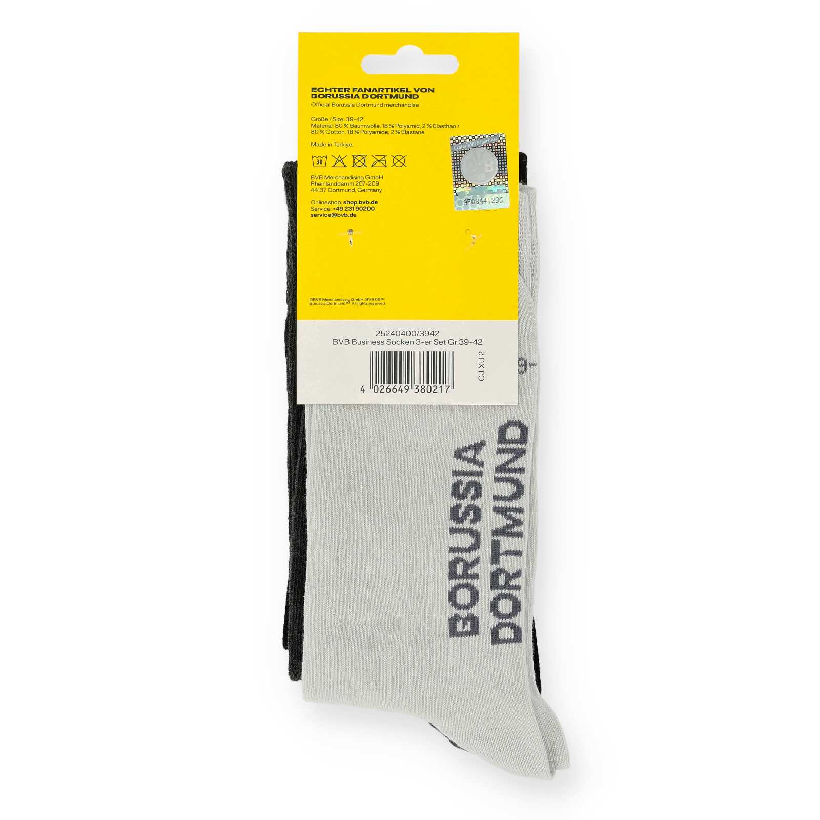Eingepackte Socken mit Rückansicht der Verpackung und Blick auf die hellgrauen Socken.