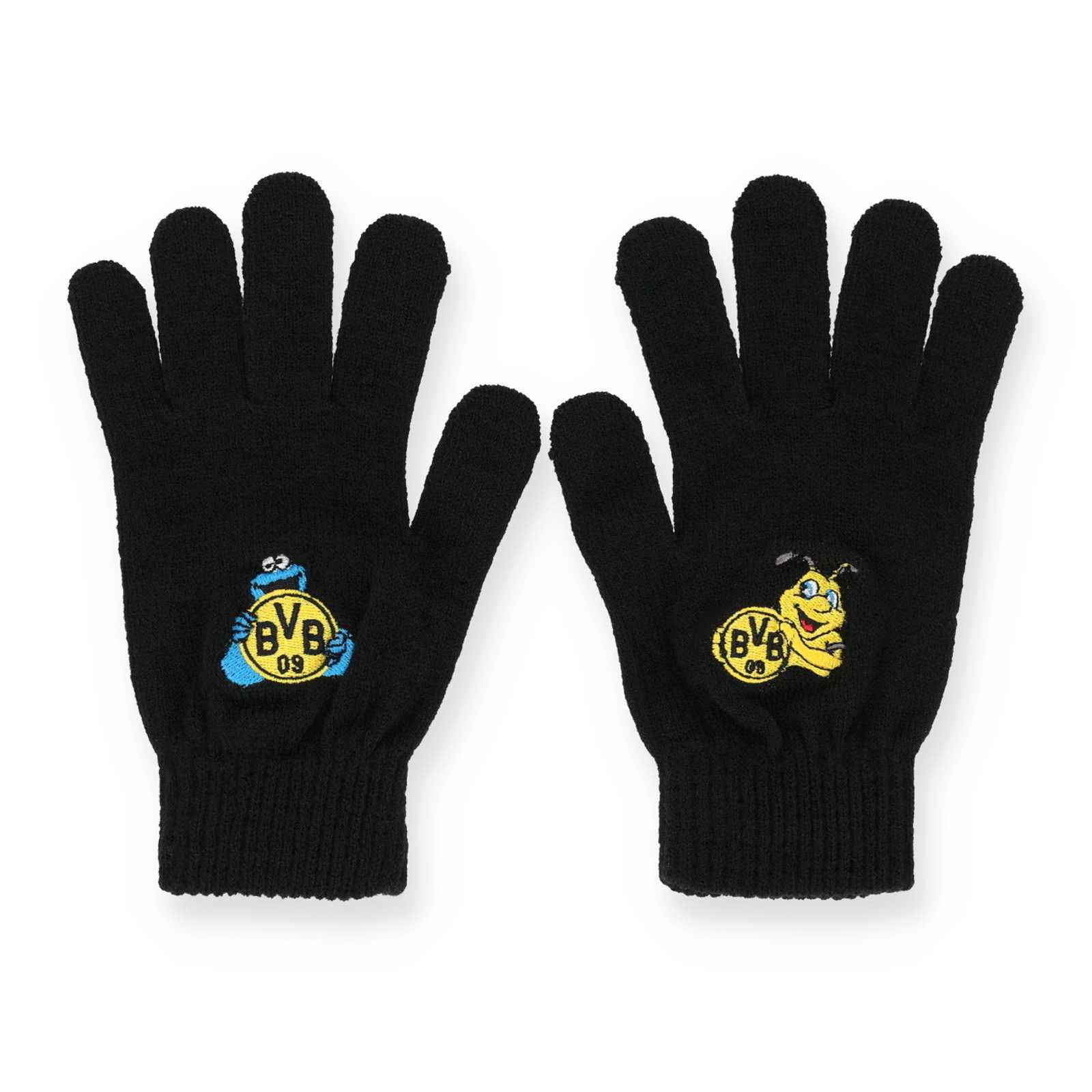 Vorderansicht der schwarzen Kinder Handschuhe. Auf einem Handschuh ist das Krümelmonster, auf dem anderen Maskottchen EMMA und beide halten das BVB-Logo in den Händen.