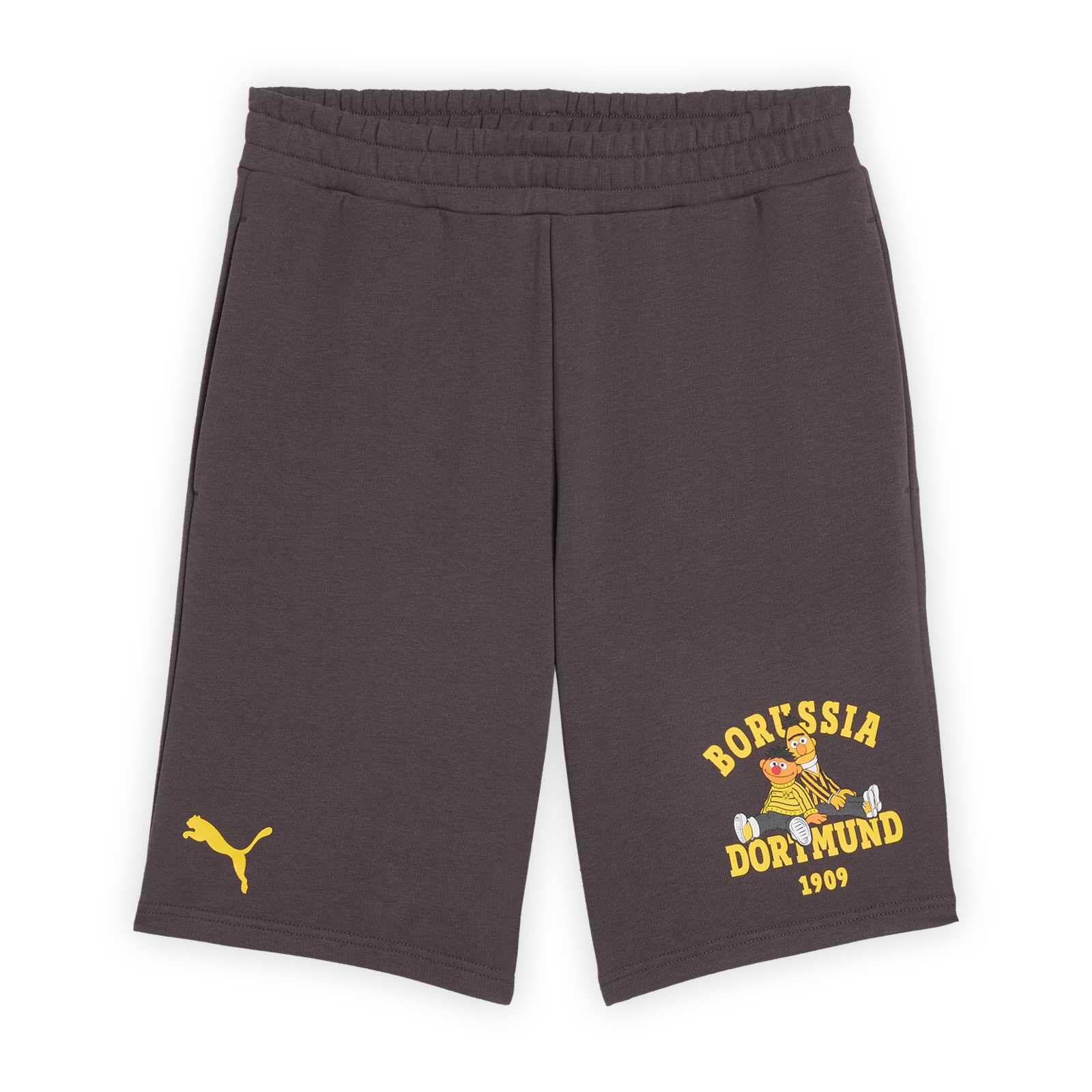 Vorderansicht der grauen Shorts mit Ernie und Bert sitzend auf dem einen Bein mit gelbem Borussia Dortmund 1909 Schriftzug aufgedruckt. Auf der anderen Seite ist eine gelbe PUMA-Katze zu sehen.